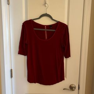 Medium Red shirt.Exposed zipper in back,sleeve at elbows